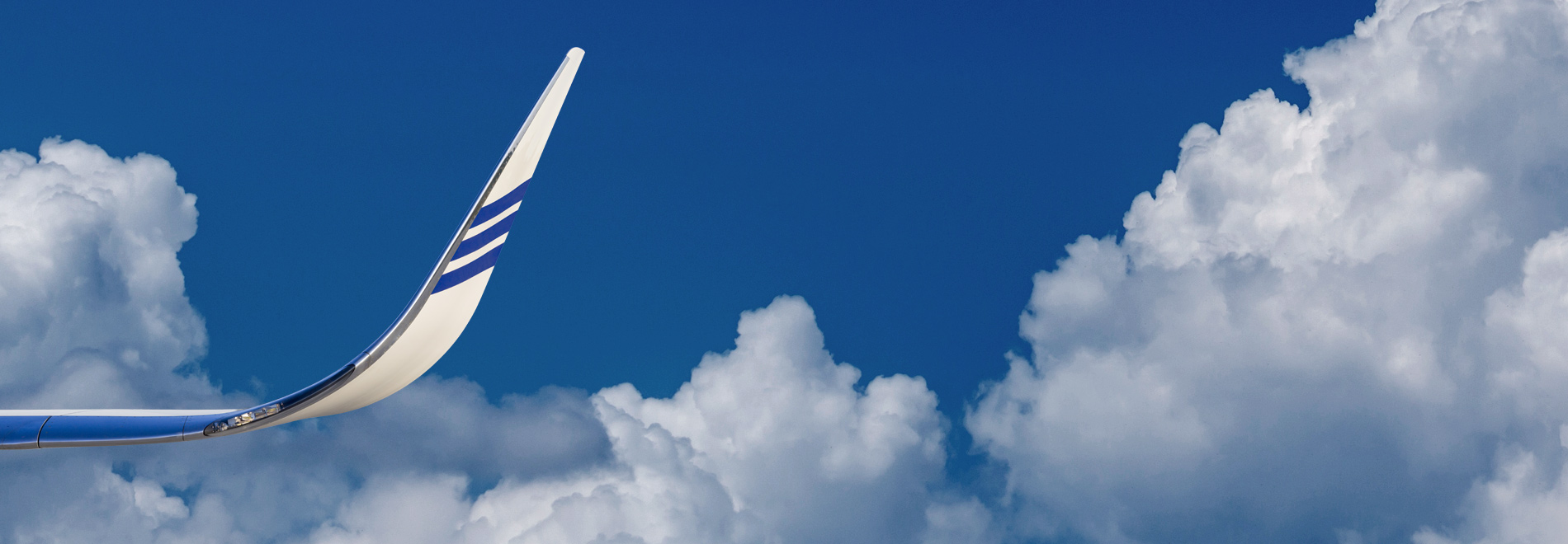 aircraft wing against a blue sky
